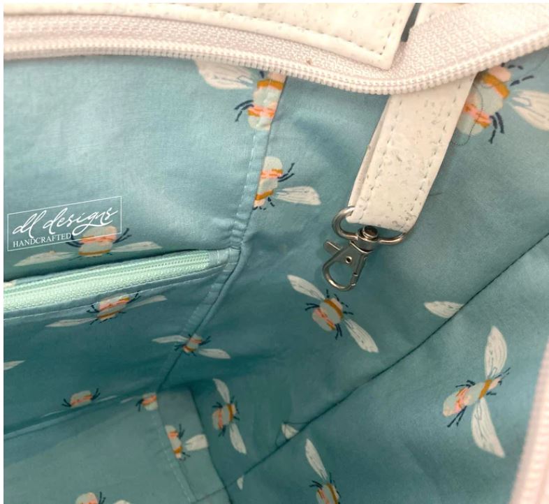 Coral vinyl and cotton floral interior of The Raelyn Bag Trio made by Siah Swag Bags