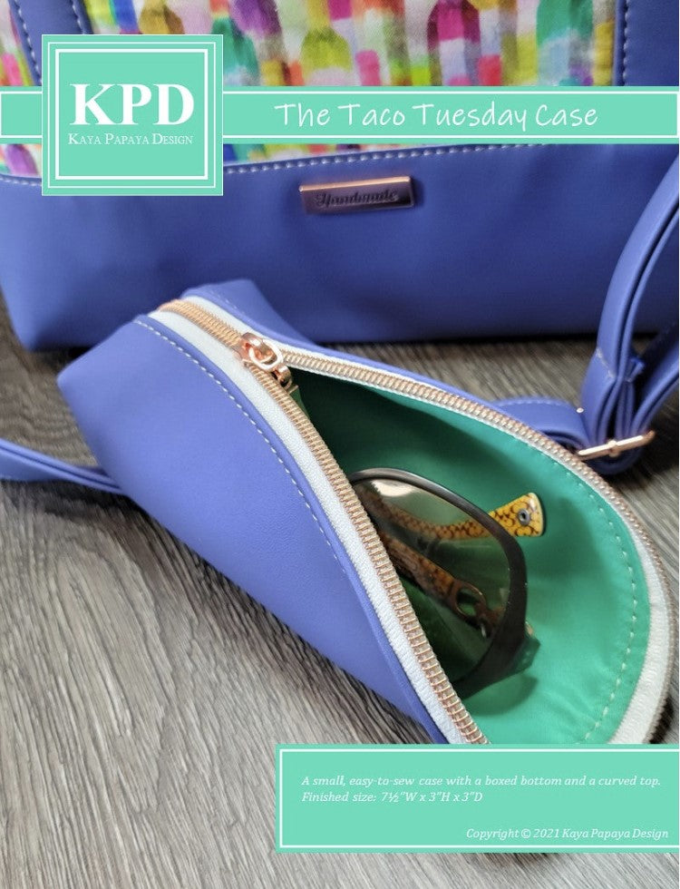 a purple zipper eyeglass case with KPD logo